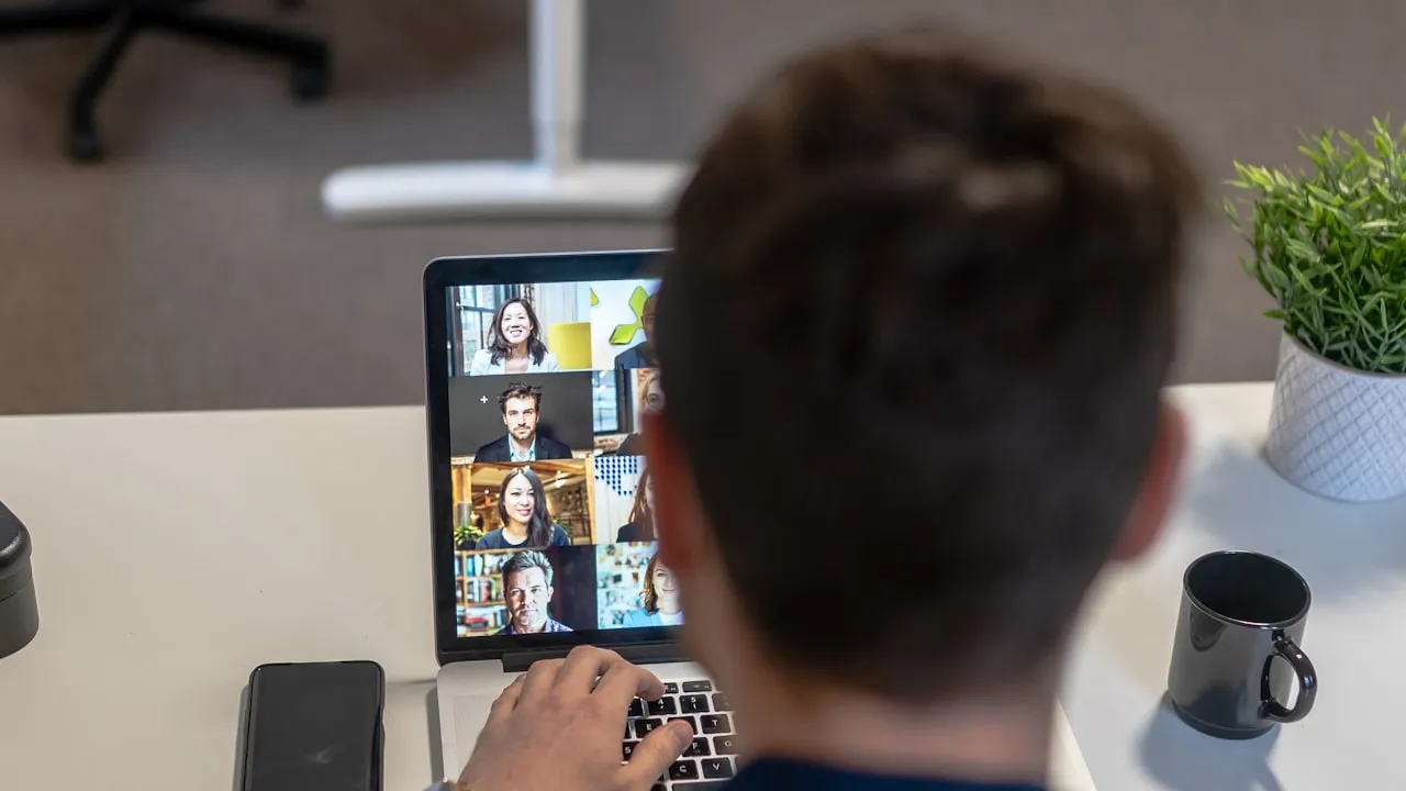 Someone joining an event remotely on a laptop