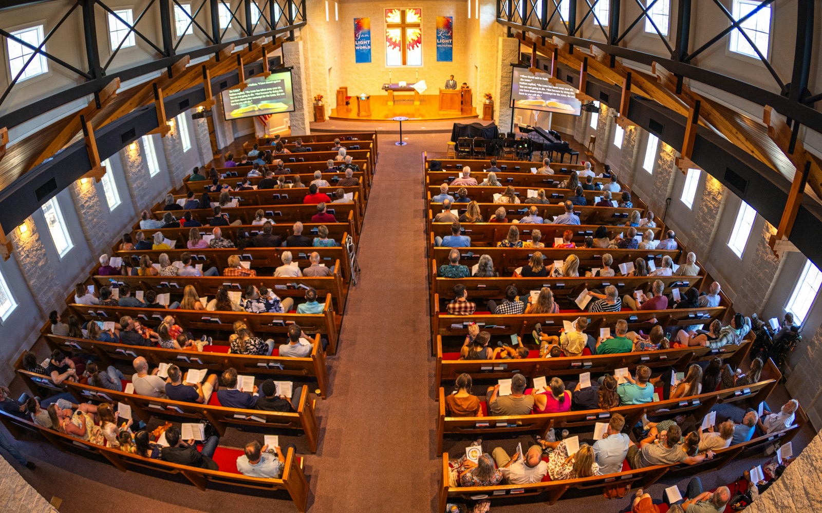 A congregation seen from the back of a sanctuary