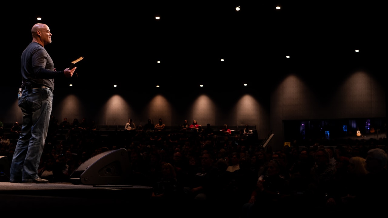 Pastor speaking to a congregation during a live sermon