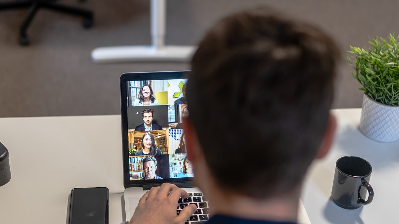 Participant joining a live video meeting from a laptop